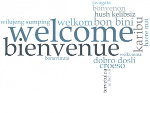 Graphic in multiple languages spelling out the word Welcome